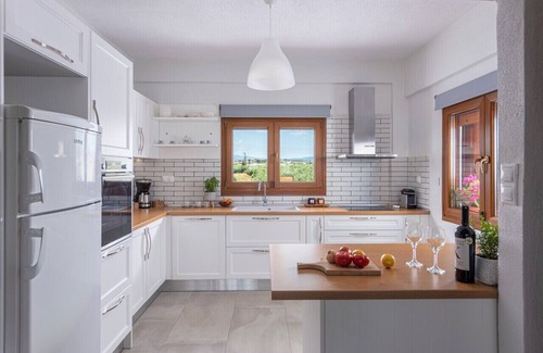 Kalivia Poliyirou Villa | Windmill Villa, a beachfront villa with private pool, for relaxing holidays