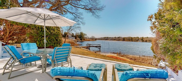 Single-level riverfront retreat, electric fireplace, & washer/dryer